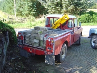  knocked some more of the garden wall down and carted away the blocks in the logrover, so that...